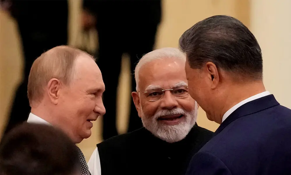 Indian Prime Minister Narendra Modi talks with Russian President Vladimir Putin and Chinese President Xi Jinping ahead of the Shanghai Cooperation Organization (SCO) Summit 2025 at the Meijiang Convention and Exhibition Centre in Tianjin, China, September 1, 2025. REUTERS
