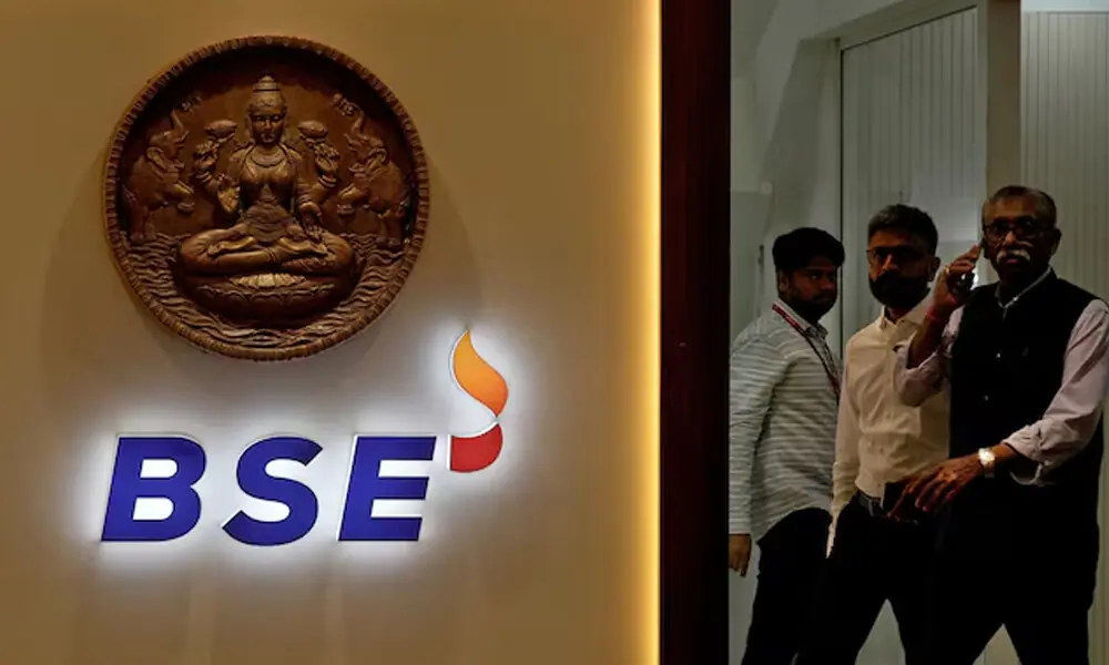 Men move past a logo of the Bombay Stock Exchange (BSE) in Mumbai, India, August 1, 2025. REUTERS Men move past a logo of the Bombay Stock Exchange (BSE) in Mumbai, India, August 1, 2025. REUTERS