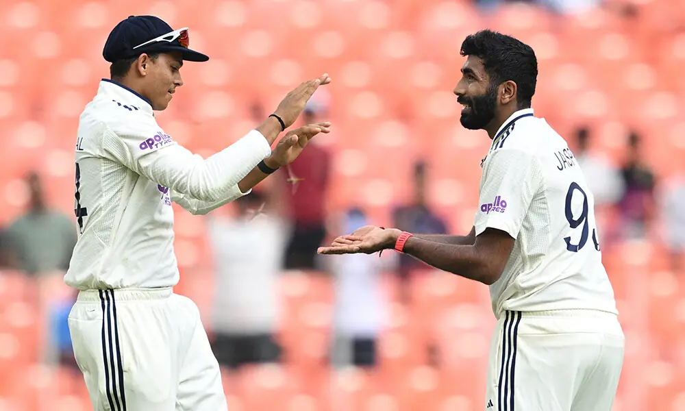 India&rsquo;s Jasprit Bumrah (R) celebrates with Yashasvi Jaiswal (L) after taking the wicket of West Indies&rsquo; Justin Greaves during the first day of the first Test cricket match between India and West Indies at the Narendra Modi Stadium in Ahmedabad on October 2, 2025. Photo: AFP