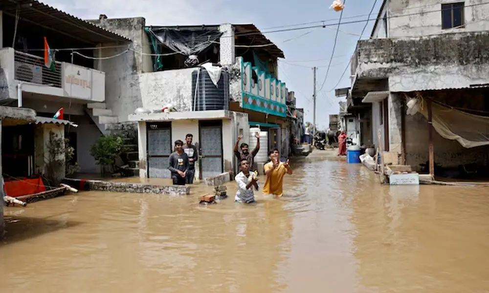 Residents in a flood-affected neighbourhood receive food packets that are being distributed by government officials following heavy rain in Kheda district of the western state of Gujarat, India, September 8, 2025. Photo: Reuters Residents in a flood-affected neighbourhood receive food packets that are being distributed by government officials following heavy rain in Kheda district of the western state of Gujarat, India, September 8, 2025. Photo: Reuters