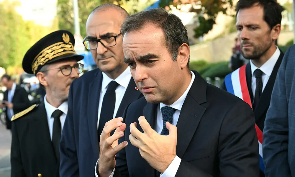 France&rsquo;s Prime Minister Sebastien Lecornu, flanked by Paris Police Prefect Laurent Nunez (2nd L), speaks to journalists after a visit to a police station in L&rsquo;Hay-les-Roses, on the southern outskirts of Paris on October 11, 2025. Photo: AFP