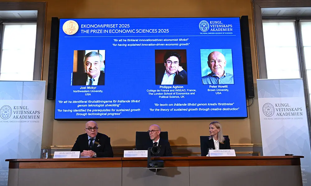Secretary General of The Royal Swedish Academy of Sciences Hans Ellegren (C) addresses journalists flanked by Members of the Economics Nobel Prize committee (L) and Kerstin Enflo during the announcement of the winner of the 2025 Nobel Prize in Economics, the Sveriges Riksbank Prize in Economic Sciences in Memory of Alfred Nobel, at the Royal Swedish Academy of Sciences in Stockholm, Sweden, on October 13, 2025. Photo: AFP
