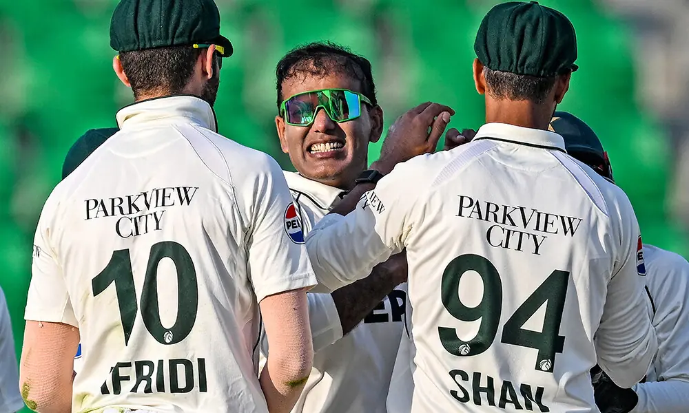 Pakistan&rsquo;s Noman Ali (C) celebrates with teammates after taking he wicket of South Africa&rsquo;s Tristan Stubbs during the second day of the first Test cricket match between Pakistan and South Africa at the Gaddafi Stadium in Lahore on October 13, 2025. Photo: AFP