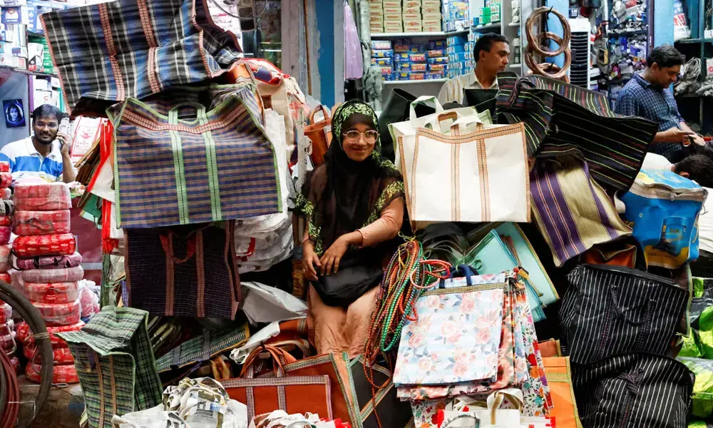 A vendor waits for customers at a wholesale market in Kolkata, India. Photo: Reuters