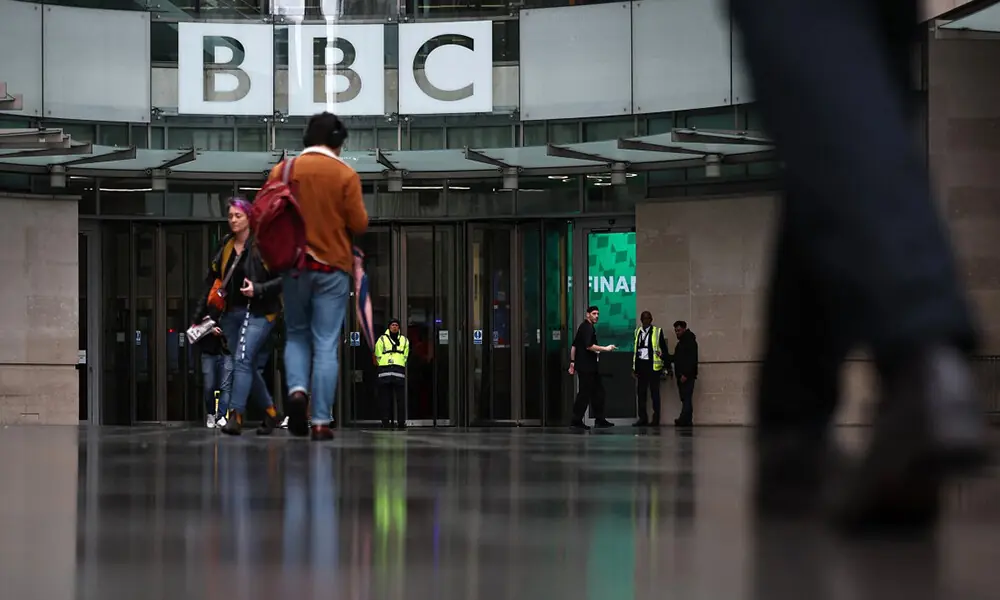 People are pictured outside the entrance to the BBC in London on November 10, 2025. Photo: AFP