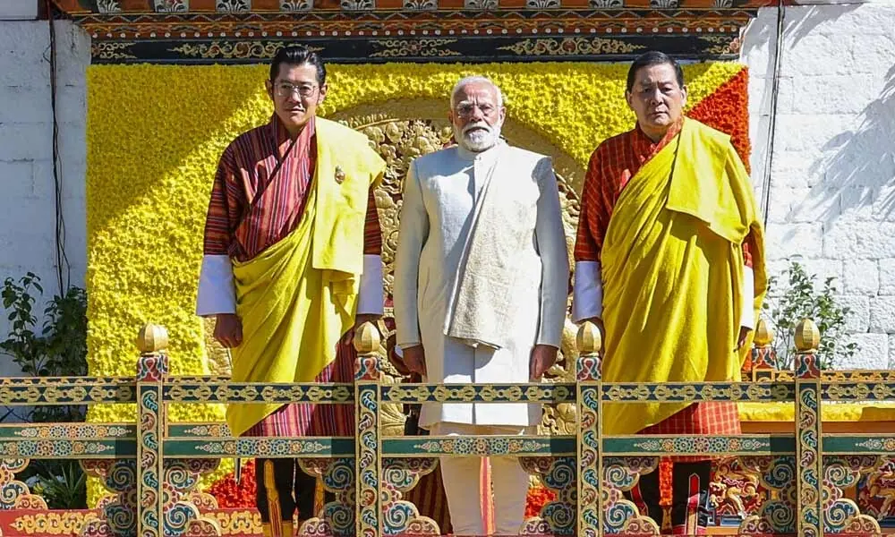 (L-R) Bhutan&rsquo;s King Jigme Khesar Namgyel Wangchuck, India&rsquo;s Prime Minister Narendra Modi and Bhutan&rsquo;s Prime Minister Lotay Tshering posing during the Fourth King&rsquo;s 70th Birth Anniversary celebrations at Changlimethang Celebration Ground in Thimphu on November 11, 2025. Photo: AFP