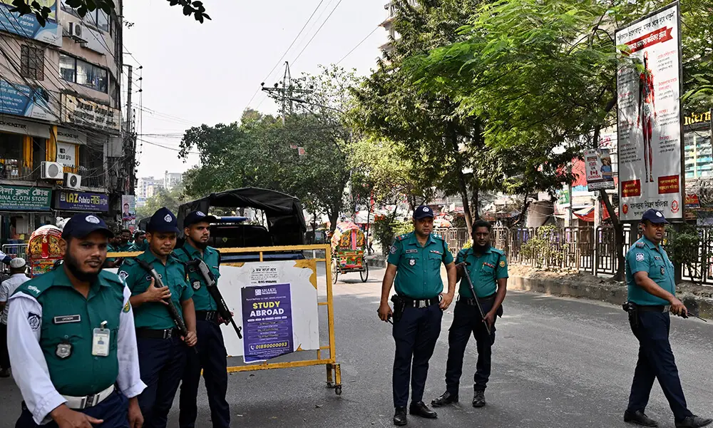 Bangladesh&rsquo;s police personnel stand guard along a road in Dhaka on November 13, 2025. Photo: AFP