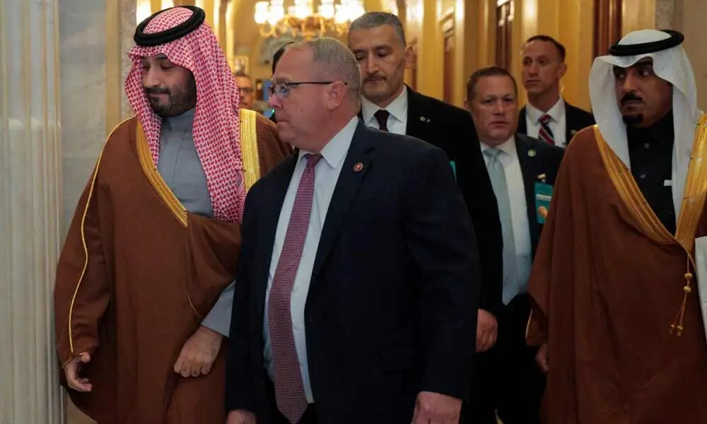 Crown Prince and Prime Minister Mohammed bin Salman of Saudi Arabia (L) is escorted by the House Sergeant At Arms William McFarland as he arrives at the U.S. Capitol on November 19, 2025 in Washington, DC. Photo: AFP
