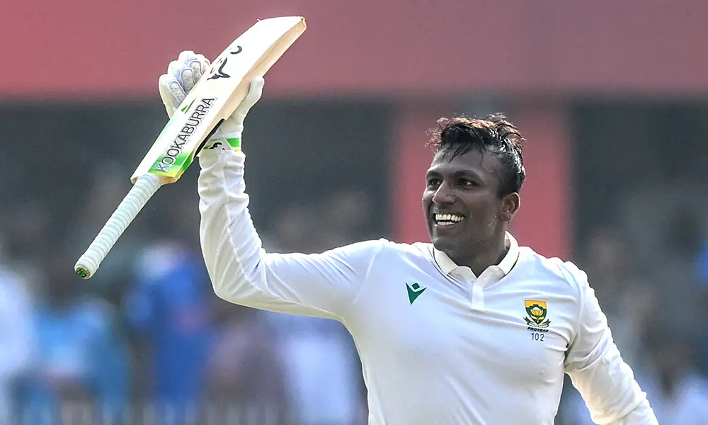 South Africa&rsquo;s Senuran Muthusamy celebrates after scoring a century (100 runs) during the second day of the second Test cricket match between India and South Africa at the Barsapara Cricket Stadium in Guwahati on November 23, 2025. Photo: AFP