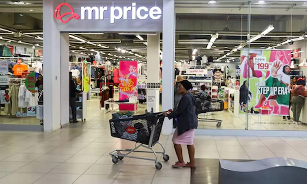 A shopper pushes a trolley outside a branch of South African clothing and homeware retailer Mr Price, at the Trade Route Mall, in Lenasia outside Johannesburg, South Africa, February 8, 2023. REUTERS A shopper pushes a trolley outside a branch of South African clothing and homeware retailer Mr Price, at the Trade Route Mall, in Lenasia outside Johannesburg, South Africa, February 8, 2023. REUTERS