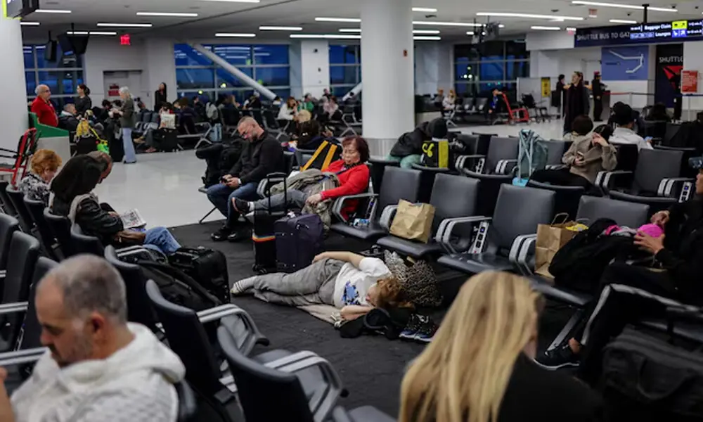 Travellers wait for a flight at John F. Kennedy (JFK) International Airport in New York City, U.S. REUTERS