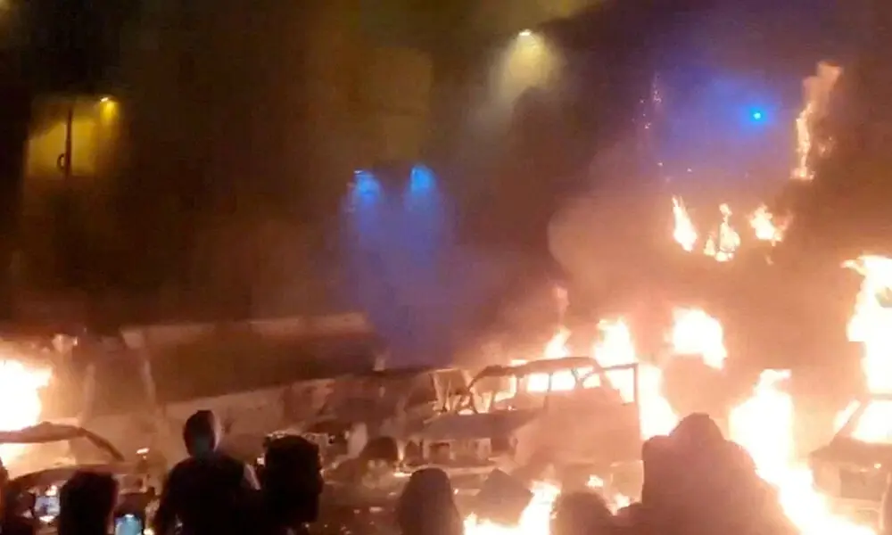 Protesters gather as vehicles burn, amid evolving anti-government unrest, in Tehran,Iran, in this screen grab obtained from a social media video released on January 9, 2026. Photo: Reuters