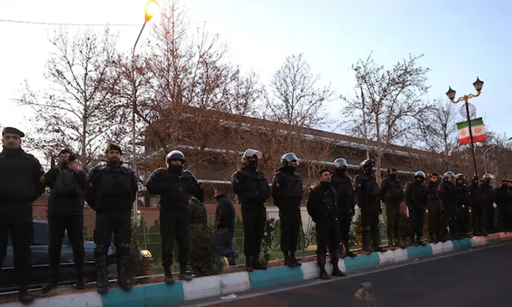 Members of the Iranian police stand guard at a protest in front of the British embassy following anti-government protests in Tehran, Iran, January 14, 2026. Majid Asgaripour/WANA (West Asia News Agency) via REUTERS