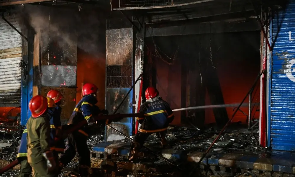 Firefighters douse a fire that broke out at a shopping mall in Karachi on January 18, 2026. Photo: AFP