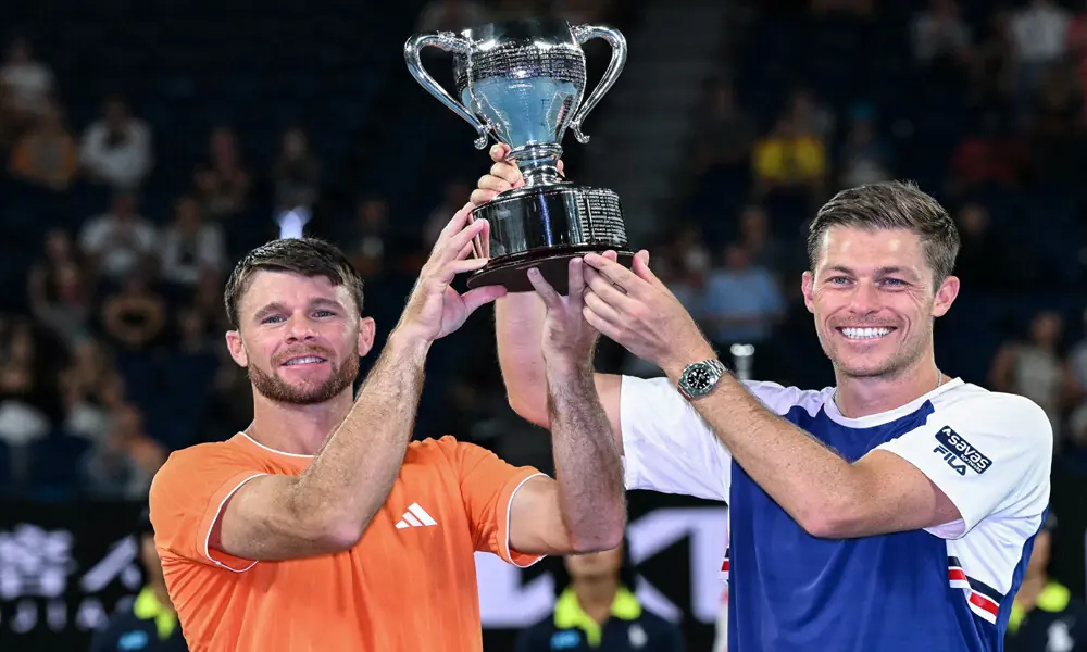 Great Britain&rsquo;s Neal Skupski (R) and his partner USA&rsquo;s Christian Harrison celebrate with the trophy after winning their men&rsquo;s doubles final match of the Australian Open tennis tournament in Melbourne on January 31, 2026. Photo: AFP