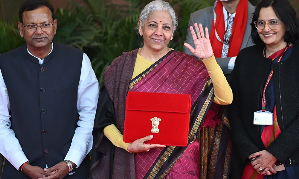 India&rsquo;s Finance Minister Nirmala Sitharaman (C) poses for photos before she leaves the Finance Ministry to present the annual budget to parliament at the Kartavya Bhavan in New Delhi on February 1, 2026. Photo: AFP