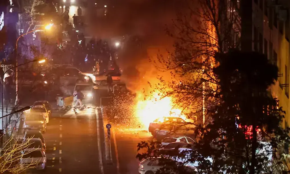 Cars burn in a street during a protest over the collapse of the currency&rsquo;s value, in Tehran, Iran, January 8, 2026. File Photo: Stringer/WANA (West Asia News Agency) via REUTERS