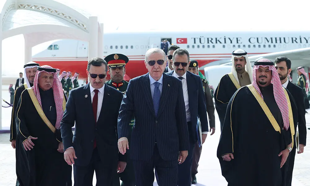 In this handout photo taken and released by the Turkish presidential press service, Turkey&rsquo;s President Recep Tayyip Erdogan (C) walks with Saudi officials upon his arrival in Riyadh on February 3, 2026. Photo: AFP
