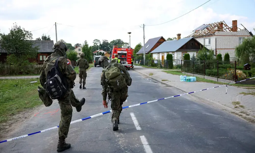 Soldiers walk next to a site where a roof of a house was destroyed, after Russian drones violated Polish airspace during an attack on Ukraine, with some being shot down by Poland with the backing from its NATO allies, in Wyryki, Lublin Voivodeship, Poland, September 10, 2025. REUTERS Soldiers walk next to a site where a roof of a house was destroyed, after Russian drones violated Polish airspace during an attack on Ukraine, with some being shot down by Poland with the backing from its NATO allies, in Wyryki, Lublin Voivodeship, Poland, September 10, 2025. REUTERS