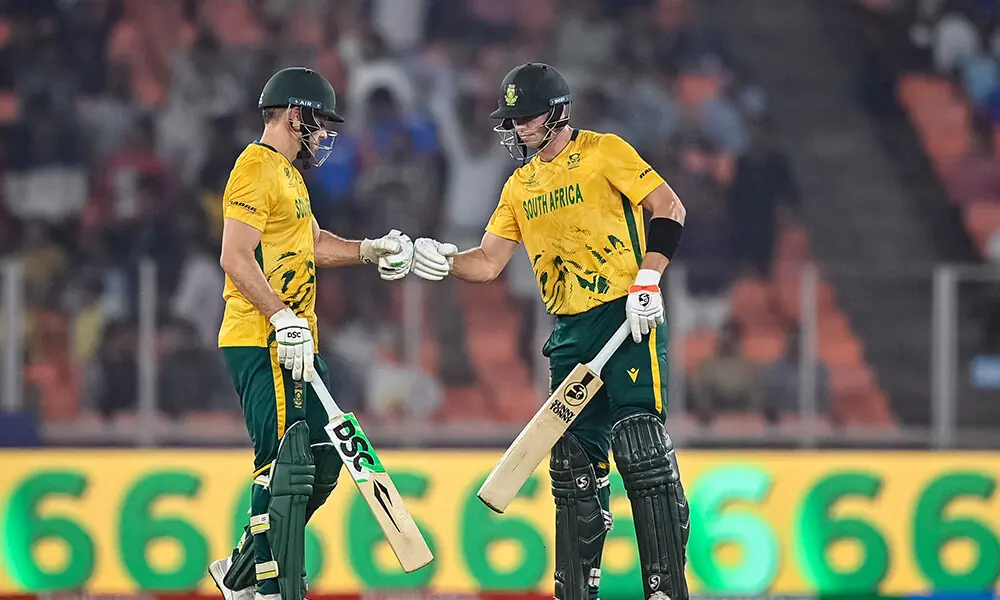 South Africa&rsquo;s David Miller (L) and Tristan Stubbs bump their fists during the 2026 ICC Men&rsquo;s T20 Cricket World Cup group stage match between South Africa and Canada at the Narendra Modi Stadium in Ahmedabad on February 9, 2026. Photo: AFP