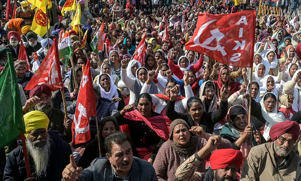 Farmers and trade union workers shout slogans during a nationwide strike over government policies and other issues in Amritsar on February 12, 2026. Photo: AFP