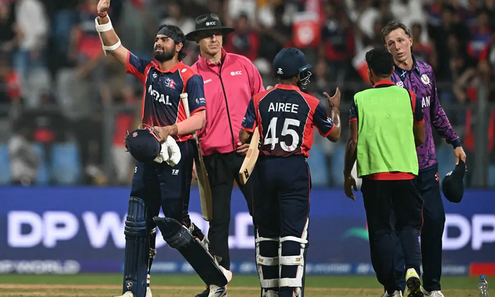 Nepal&rsquo;s Gulsan Jha (L) waves to the crowd after their victory in the 2026 ICC Men&rsquo;s T20 Cricket World Cup group stage match against Scotland at the Wankhede Stadium in Mumbai on February 17, 2026. Photo: AFP