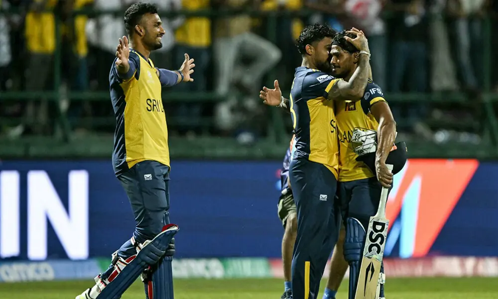 Sri Lanka&rsquo;s Pathum Nissanka (R) is congratulated by Kusal Mendis (C) and captain Dasun Shanaka for his innings as they celebrate their team&rsquo;s win against Australia at the end of their 2026 ICC Men&rsquo;s T20 Cricket World Cup group stage match in the Pallekele International Cricket Stadium, Kandy on February 16, 2026. Photo: AFP