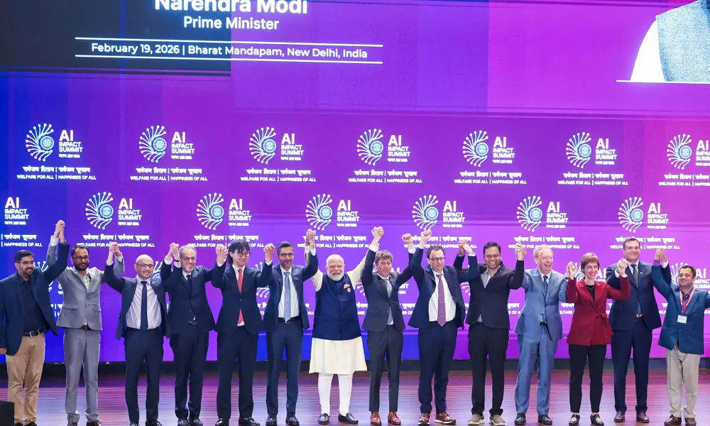 India&rsquo;s Prime Minister Narendra Modi poses for a photograph with Google and Alphabet CEO Sundar Pichai, OpenAI CEO Sam Altman, CEO of Anthropic Dario Amodei, and other global tech leaders at the AI Impact Summit, in New Delhi, India February 19, 2026. Photo: Reuters