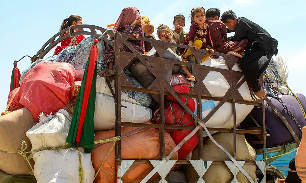 Afghan refugee children board a truck loaded with their belongings as they wait for their deportation to Afghanistan, at a holding centre near the Pakistan-Afghanistan border in Chaman on April 15, 2025. File Photo: AFP