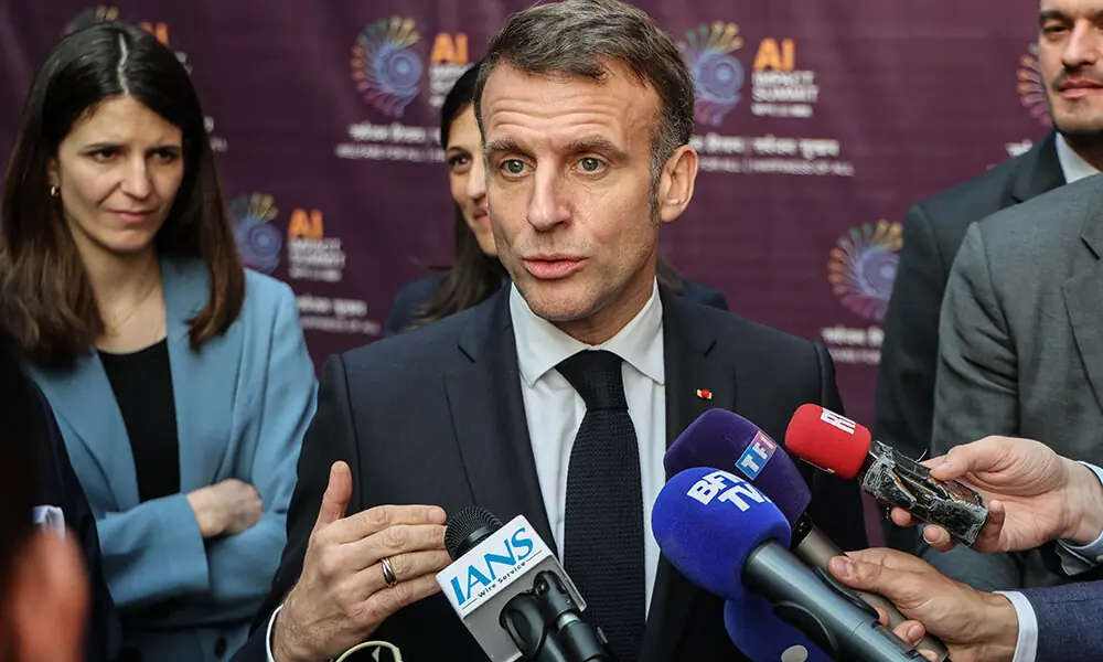 France&rsquo;s President Emmanuel Macron speaks with media after attending the AI Impact Summit in New Delhi on February 19, 2026. Photo: AFP