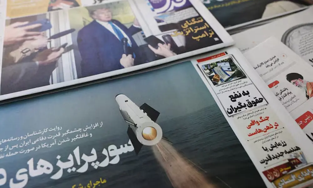 An Iranian newspaper with a cover photo of an Iranian missile, in Tehran, Iran, February 19, 2026. Photo: Reuters