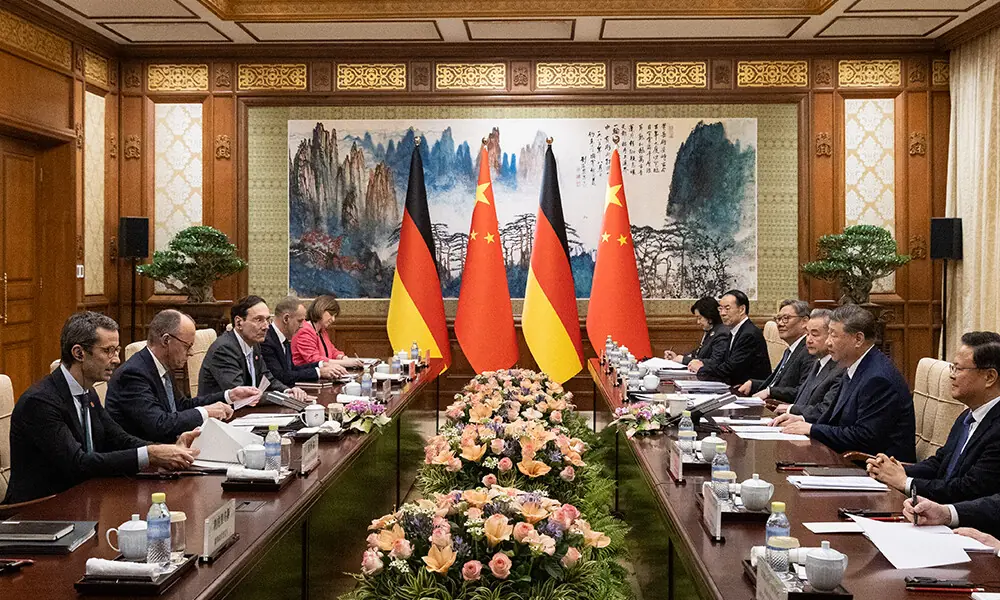 German Chancellor Friedrich Merz (2nd L) participates in a meeting with Chinese President Xi Jinping (2nd R) at the Diaoyutai State Guesthouse in Beijing on February 25, 2026. Photo: AFP