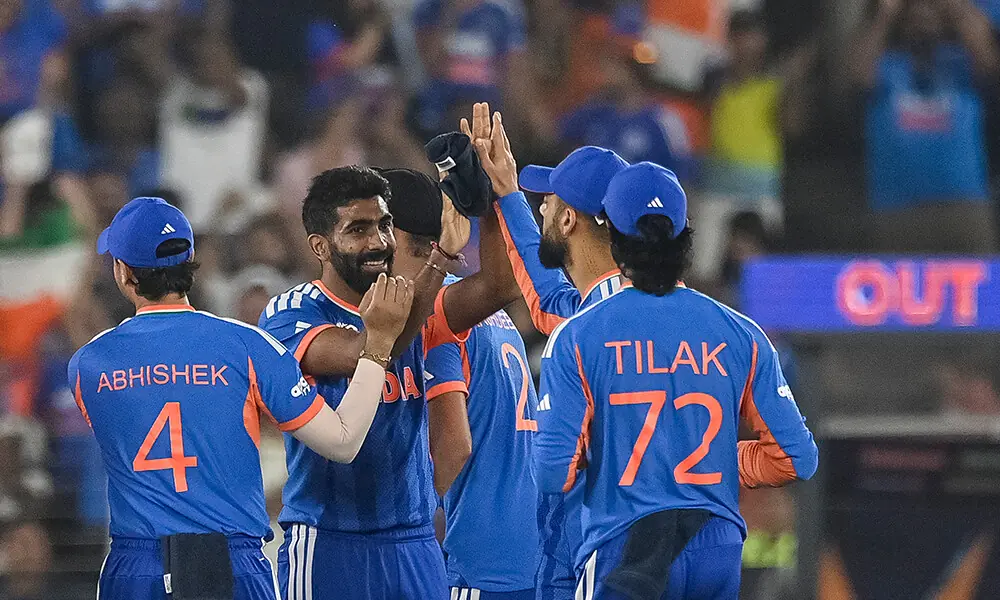 India&rsquo;s Jasprit Bumrah (2L) celebrates with teammates after taking the wicket of South Africa&rsquo;s Ryan Rickelton during the 2026 ICC Men&rsquo;s T20 Cricket World Cup Super Eights match between India and South Africa at the Narendra Modi Stadium in Ahmedabad on February 22, 2026. Photo: AFP
