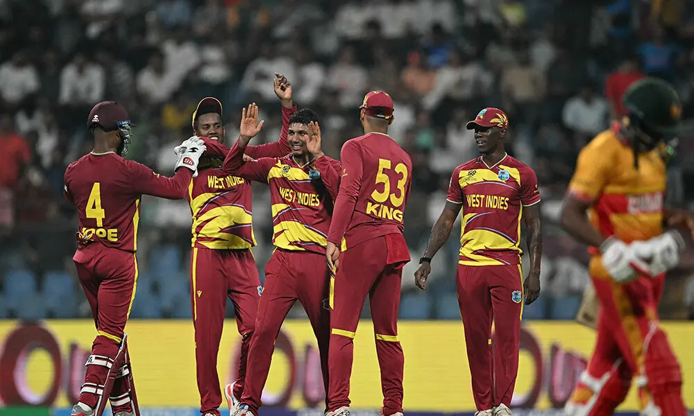 West Indies&rsquo; Gudakesh Motie (C) celebrates after taking the wicket of Zimbabwe&rsquo;s Tashinga Musekiwa during the 2026 ICC Men&rsquo;s T20 Cricket World Cup Super Eights match between West Indies and Zimbabwe at the Wankhede Stadium in Mumbai on February 23, 2026. Photo: AFP
