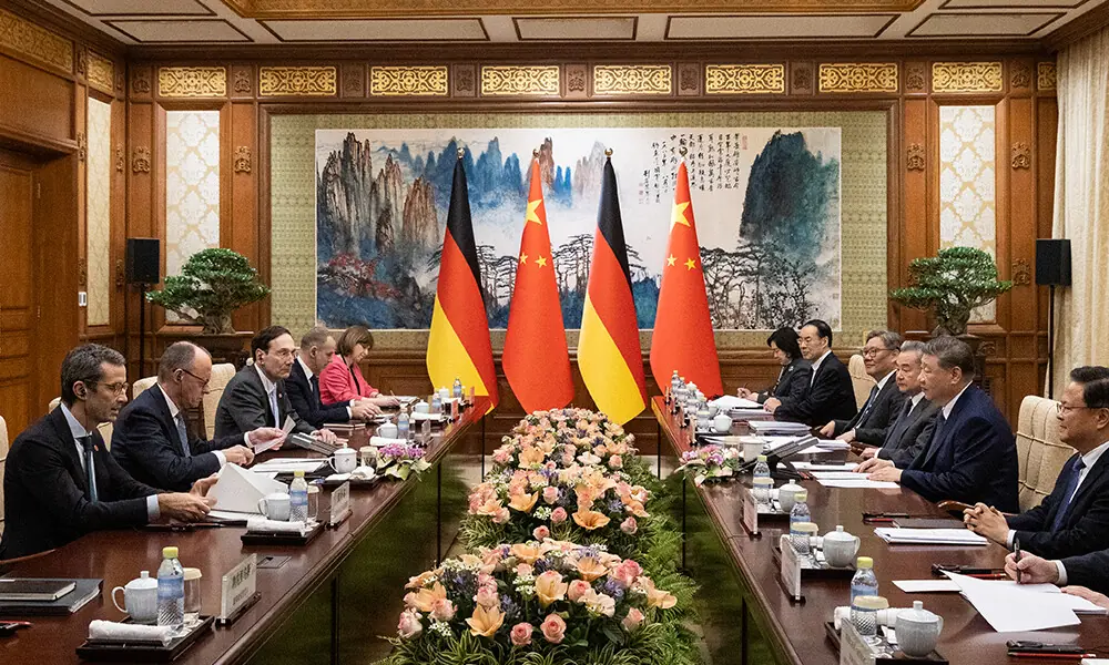 German Chancellor Friedrich Merz (2nd L) participates in a meeting with Chinese President Xi Jinping (2nd R) at the Diaoyutai State Guesthouse in Beijing on February 25, 2026. Photo: AFP