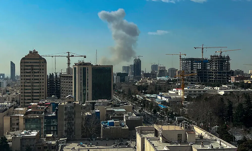 A plume of smoke rises following a reported explosion in Tehran on February 28, 2026. Photo: AFP