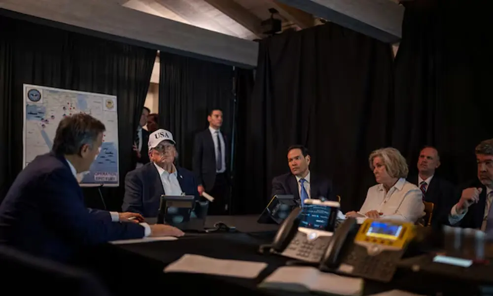 U.S. President Donald Trump speaks with CIA Director John Ratcliffe, accompanied by White House Chief of Staff Susie Wiles and Secretary of State Marco Rubio, during military operations in Iran, at Trump&rsquo;s Mar-a-Lago resort in Palm Beach, Florida, U.S. The White House/Social Media/Handout via Reuters