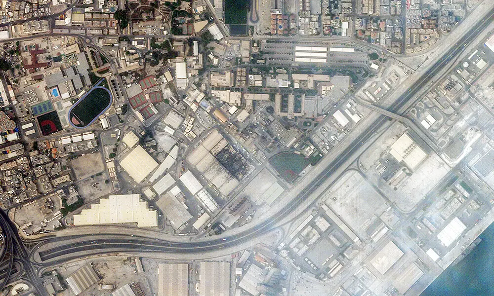 This handout satellite image taken by 2026 Planet Labs PBC on March 1, 2026 shows a view of smoke rising from damage at the US Fifth fleet naval base in Bahrain&rsquo;s capital Manama after it was hit by Iranian strikes. Photo: AFP