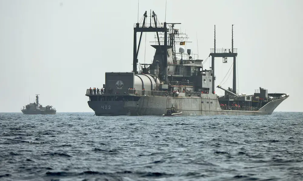 A Sri Lanka Navy vessel approaches an Iranian vessel during a rescue operation, a day after the crew of a distressed Iranian military ship, IRIS Dena were assisted in waters south of Sri Lanka, off the coast of Colombo, Sri Lanka. Sri Lanka Navy/Handout via Reuters