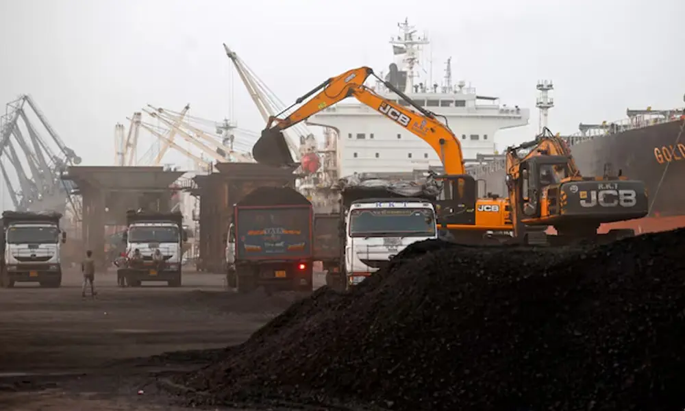 A JCB machine loads coal onto a dumper at the Deendayal Port in Kandla, in the western state of Gujarat, India, September 25, 2024. File Photo: Reuters