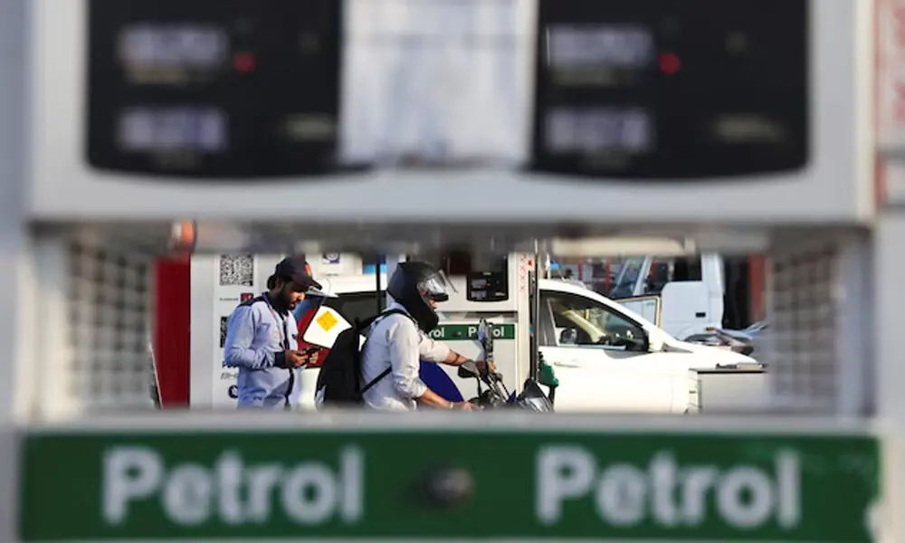 A customer leaves after refuelling his bike at a fuel station in New Delhi, India, March 6, 2026. REUTERS