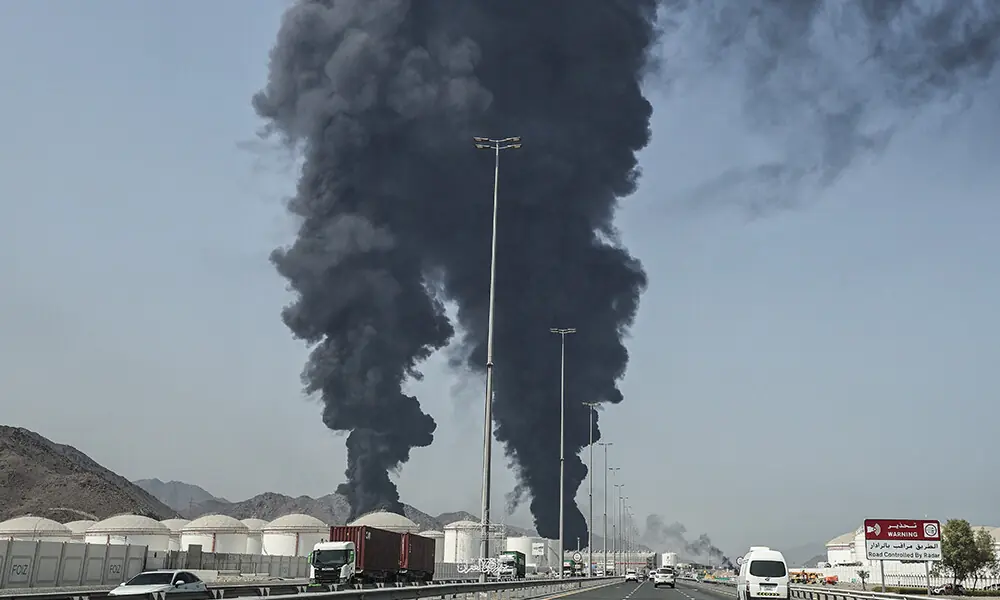 Smoke rises from the direction of an energy installation in the Gulf emirate of Fujairah on March 14, 2026. Photo: AFP