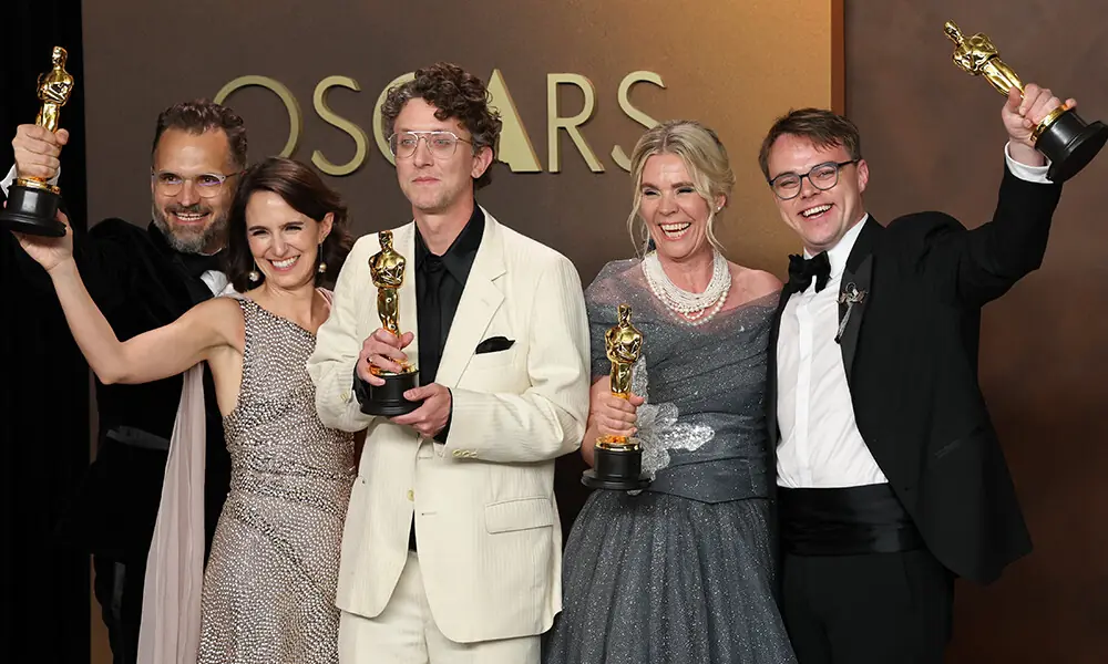 (L/R) Radovan Sibrt, Alzbeta Karaskova, US documentary filmmaker David Borenstein, Helle Faber, and Pavel Talankin pose in the press room with the Oscar for best Best Documentary Feature Film for &ldquo;Mr. Nobody Against Putin&rdquo; during the 98th Annual Academy Awards at the Dolby Theatre in Hollywood, California on March 15, 2026. Photo: AFP
