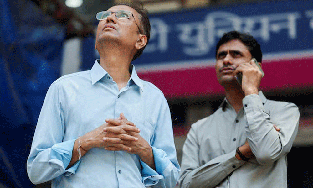 Men watch market results on a screen outside the Bombay Stock Exchange (BSE) in Mumbai, India. REUTERS Men watch market results on a screen outside the Bombay Stock Exchange (BSE) in Mumbai, India. REUTERS