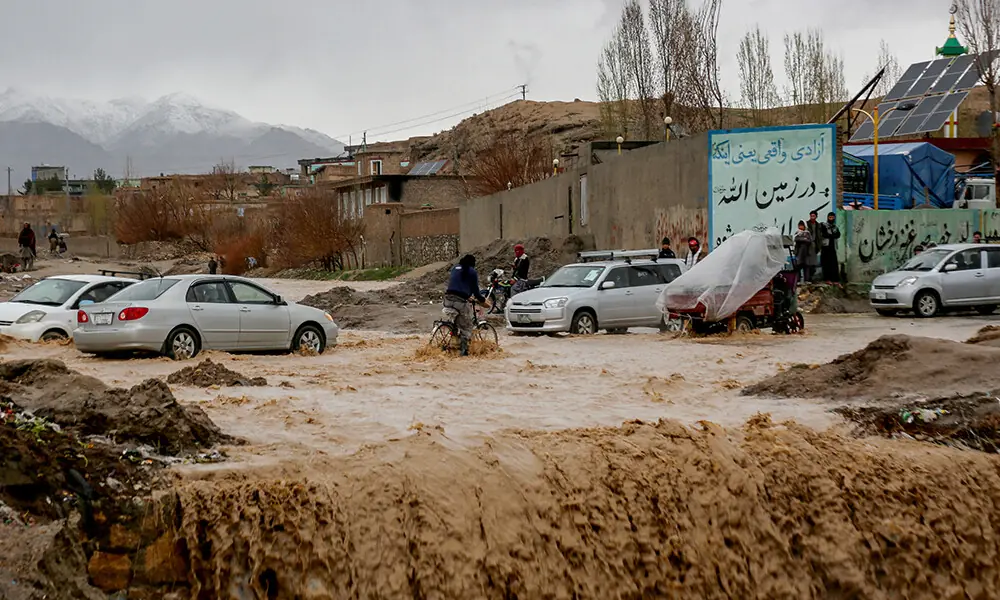 Afghan men look on as floodwaters inundate a street in Ghazni on April 6, 2026. Photo: AFP Afghan men look on as floodwaters inundate a street in Ghazni on April 6, 2026. Photo: AFP
