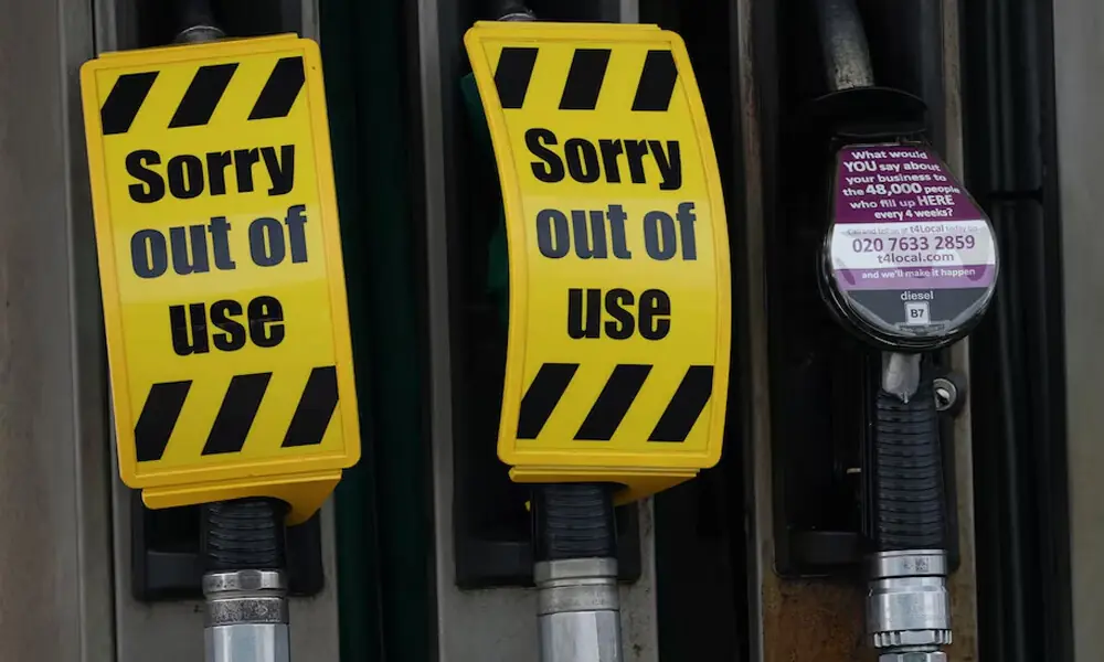 Out of use signs hang from the nozzles of empty unleaded petrol pumps on the forecourt of a petrol station in Manchester, Britain, March 23, 2026 Photo: Reuters