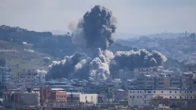 Smoke rises from an explosion in the Abbasiyeh neighbourhood following an Israeli strike, in Tyre, Lebanon. Reuters