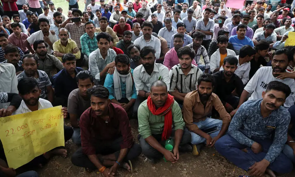 Factory workers hold a protest demanding wage hikes from their company, in Manesar, Haryana, India, April 7, 2026. File Photo: Reuters