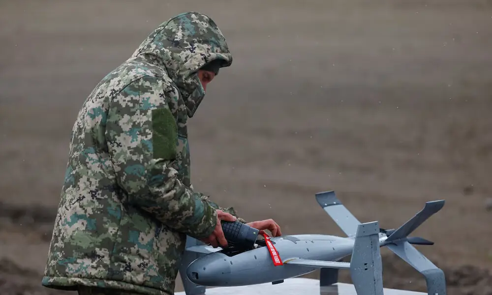 Ukrainian service member Anatolii installs a warhead into an AS3 interceptor unmanned aerial vehicle, a part of a modular American-made, AI-powered counter-drone system MEROPS, during a training in an undisclosed location, amid Russia&rsquo;s attack on Ukraine, April 10, 2026. REUTERS
