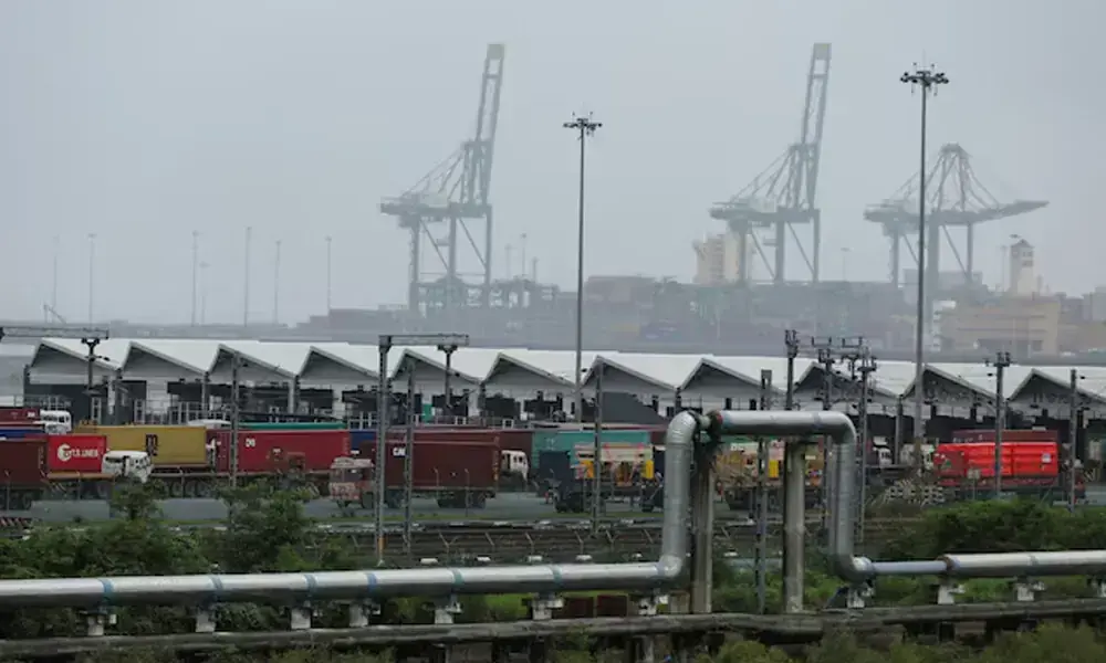 Trucks with shipping containers are parked at Jawaharlal Nehru Port, in Navi Mumbai, India. Photo: Reuters